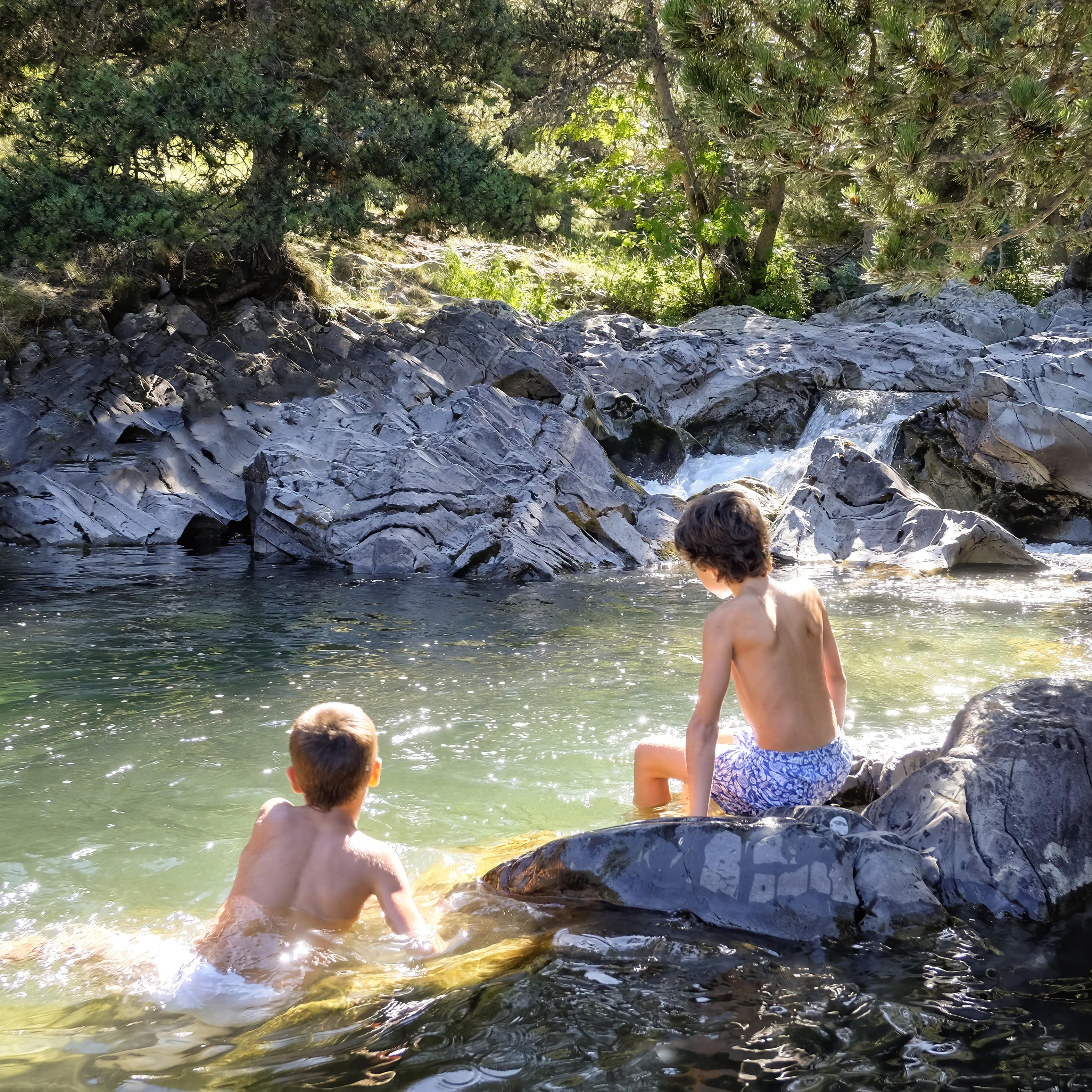 Two boys by rock pool
