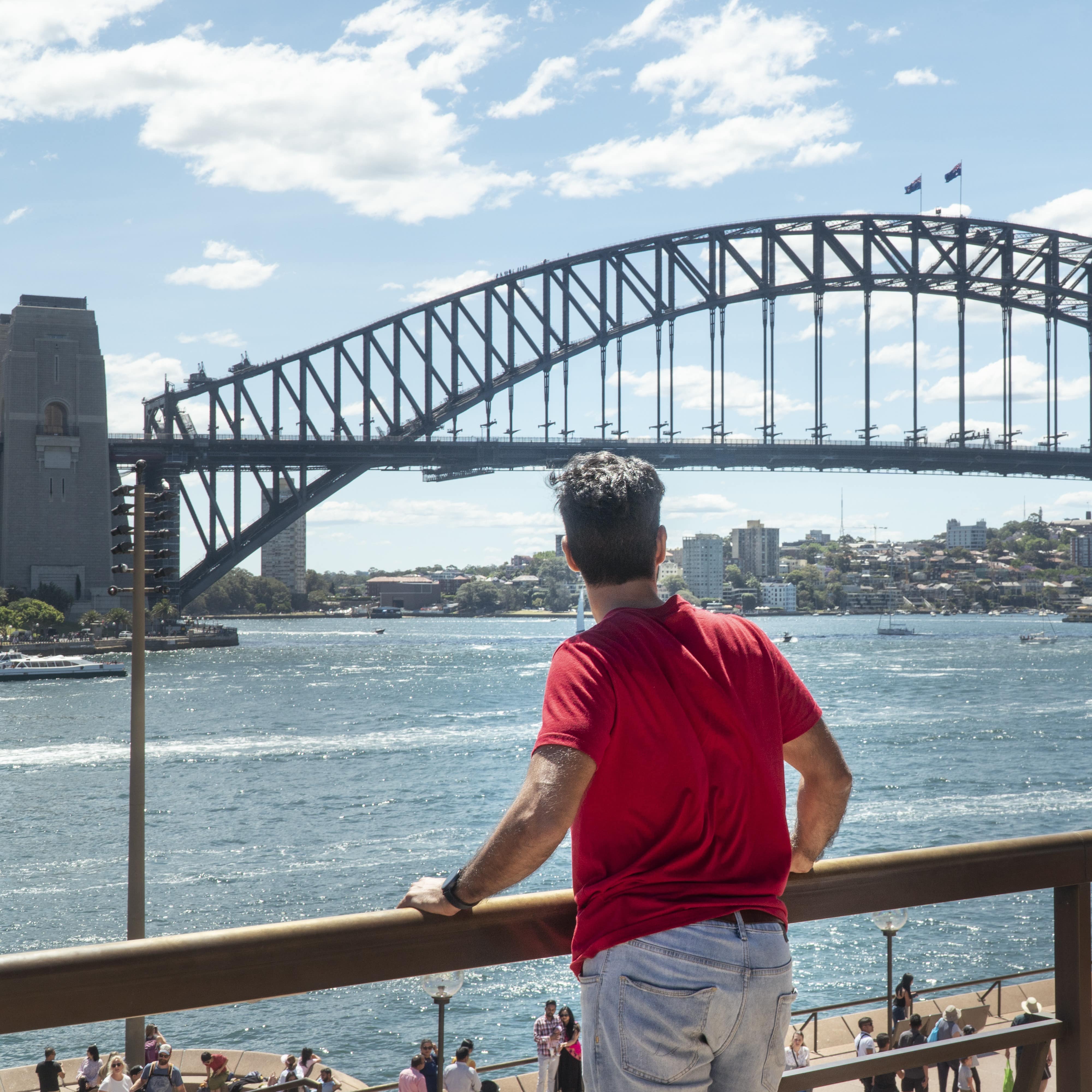 Man looking at Sydney Harbour Bridge