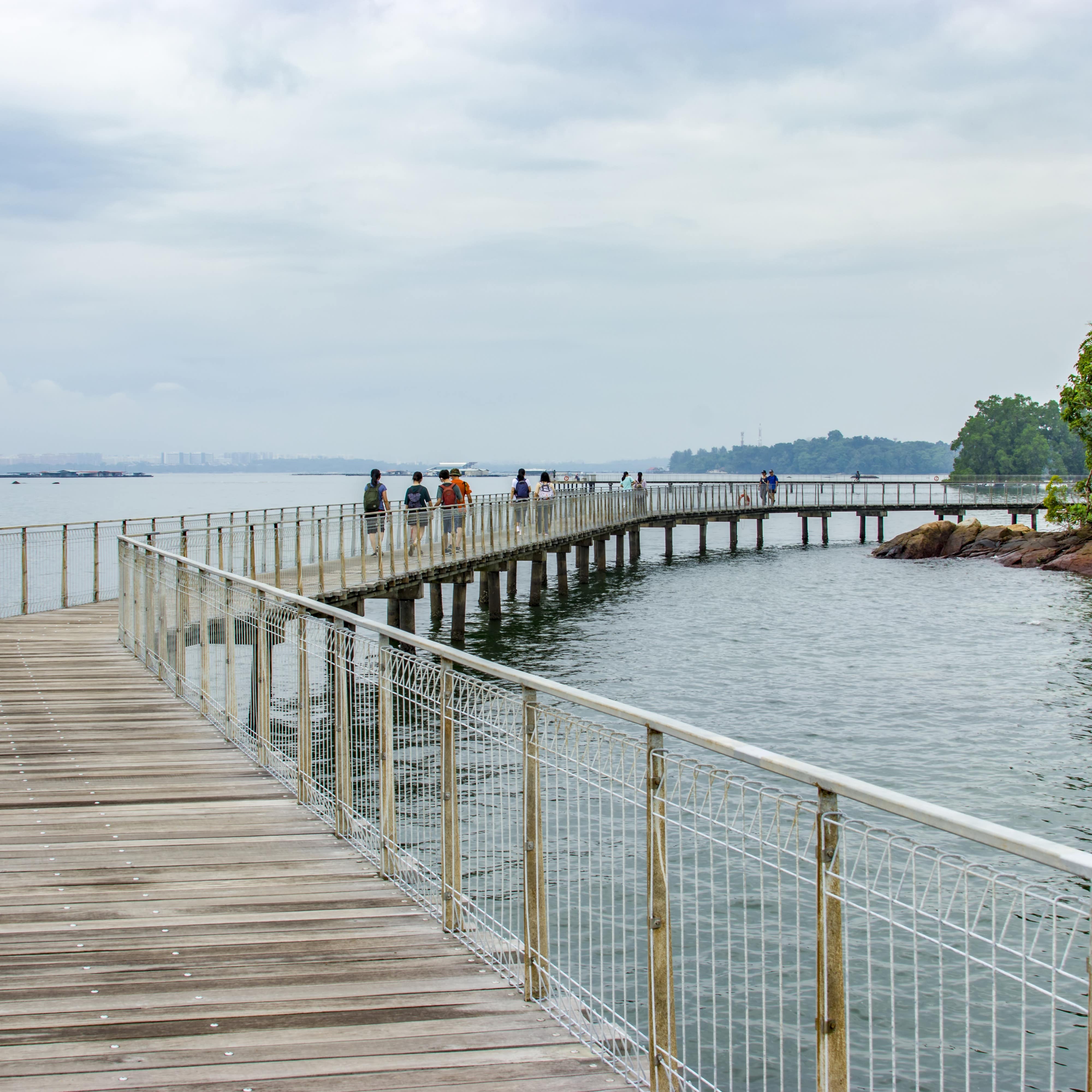 People walking on the boardwalk on Pulau Ubin Island