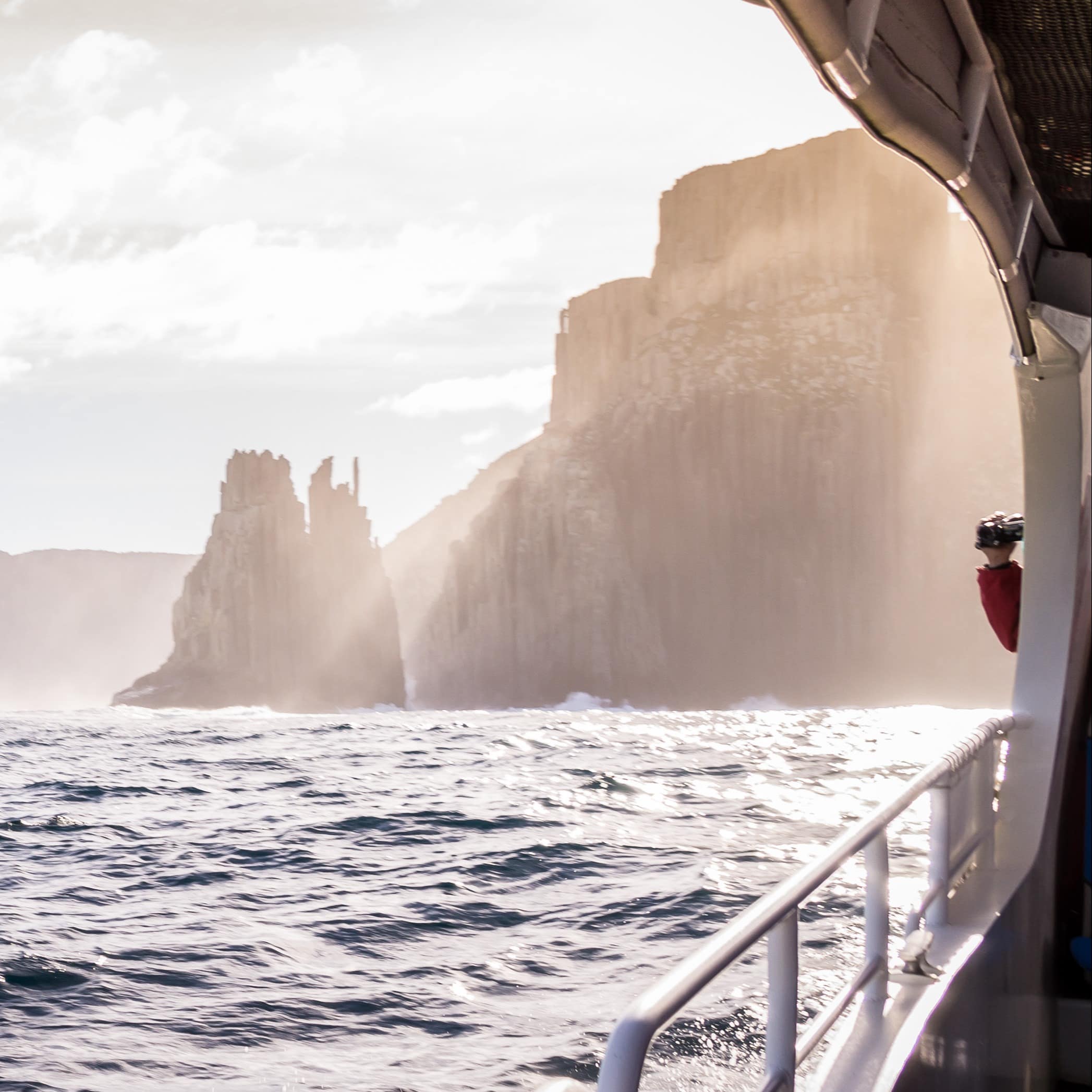 View from tour boat with handrail on Tasman Island, Tasmania, Australia File