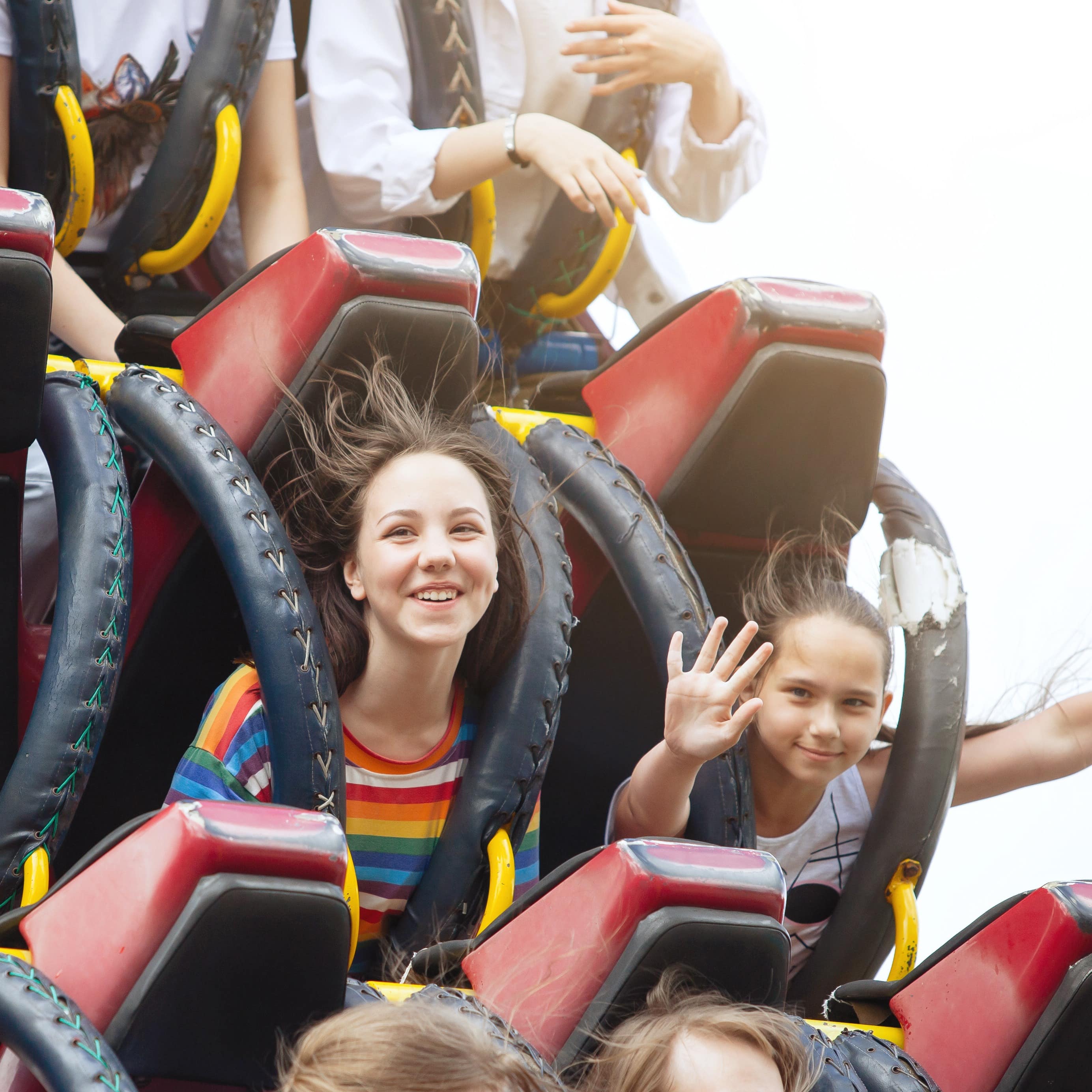 Sisters riding a roller coaster
