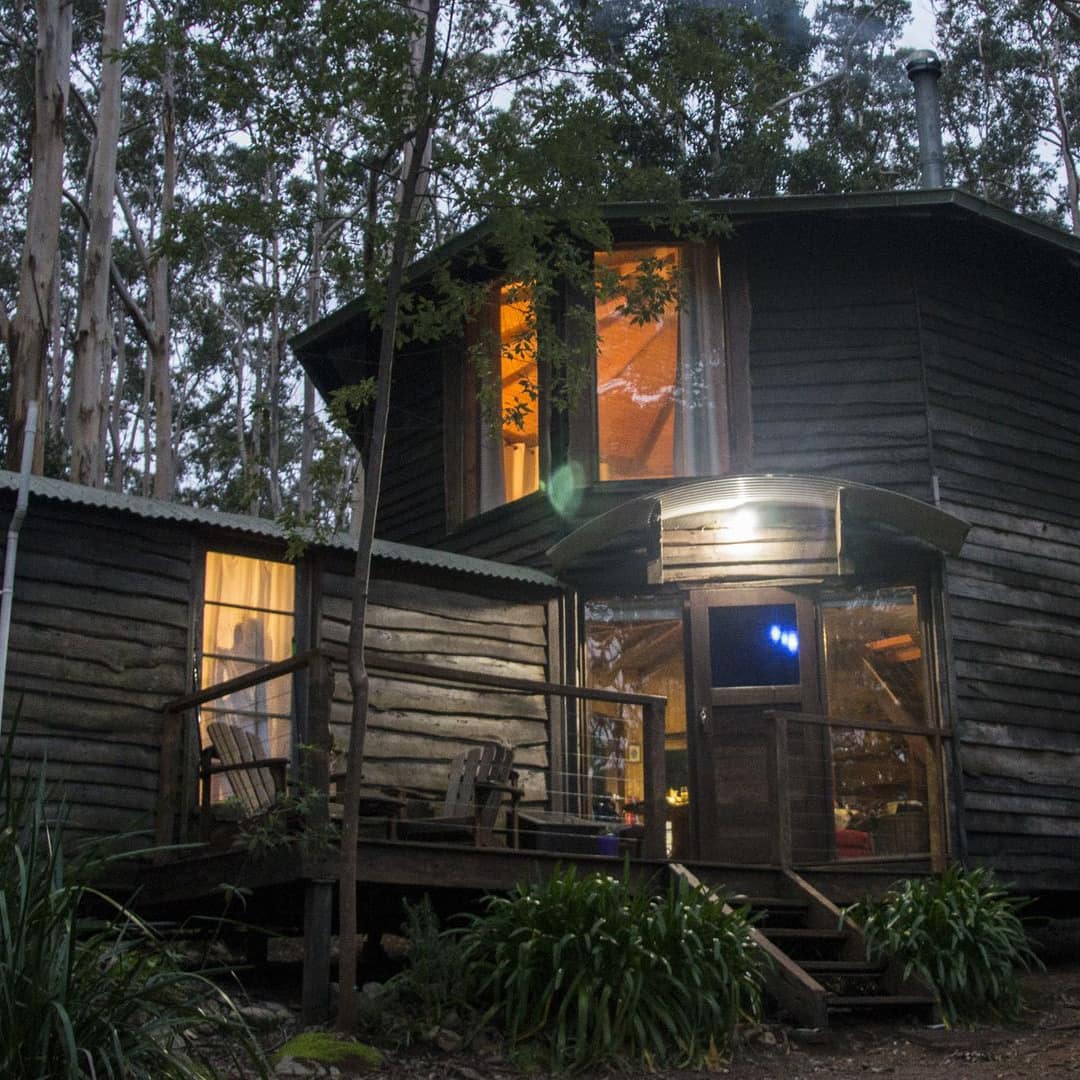 Unique hexagonal 1-bedroom chalet made of hand-sewn logs with a porch and upper deck near Denmark