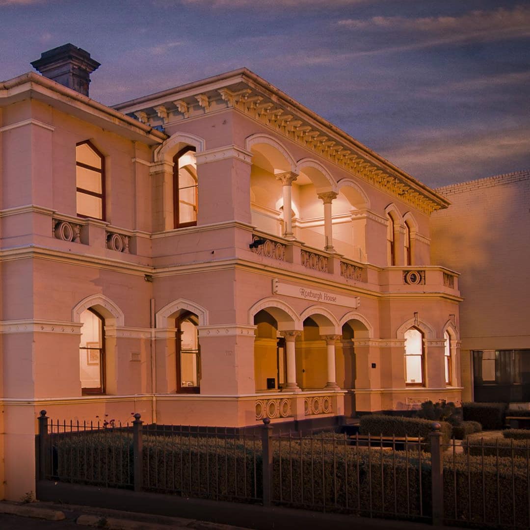 Gorgeous exterior of Victorian Italianate-style apartment building in the heart of Hobart Central Business District at sunset