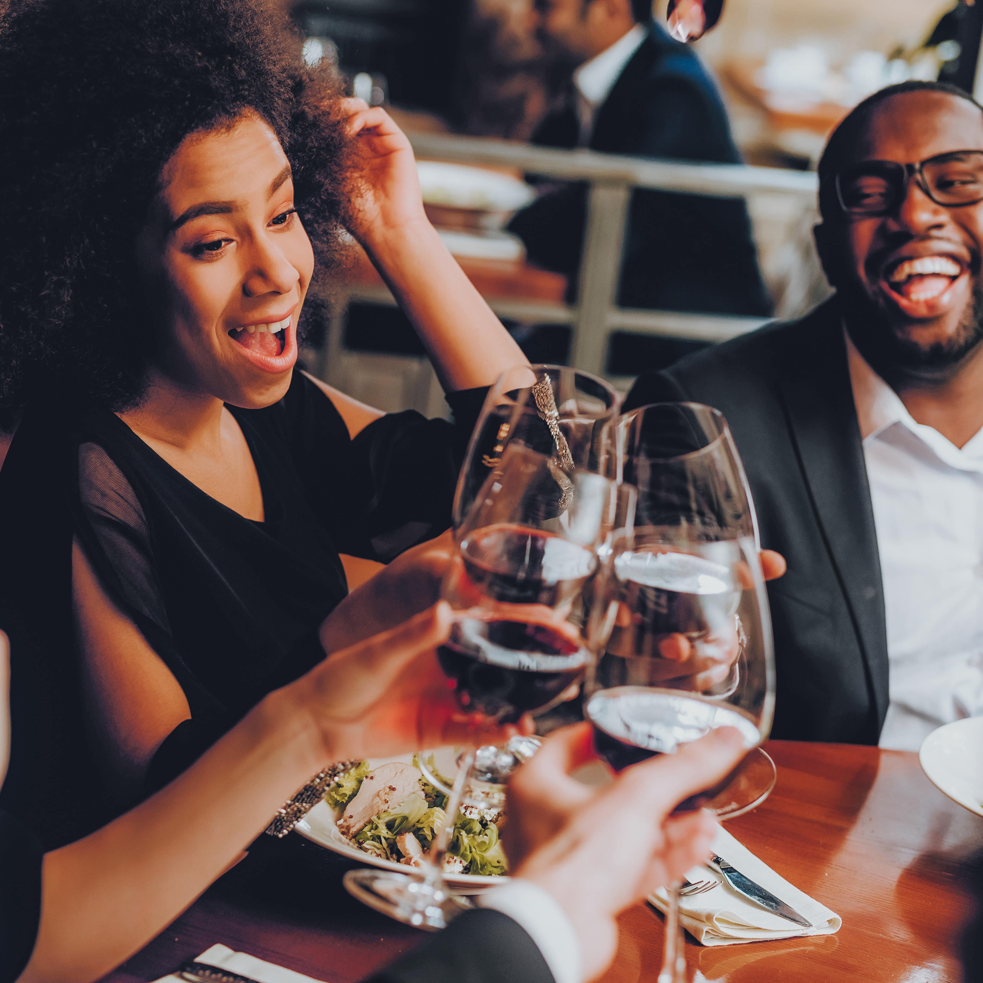 Friends toasting at dinner
