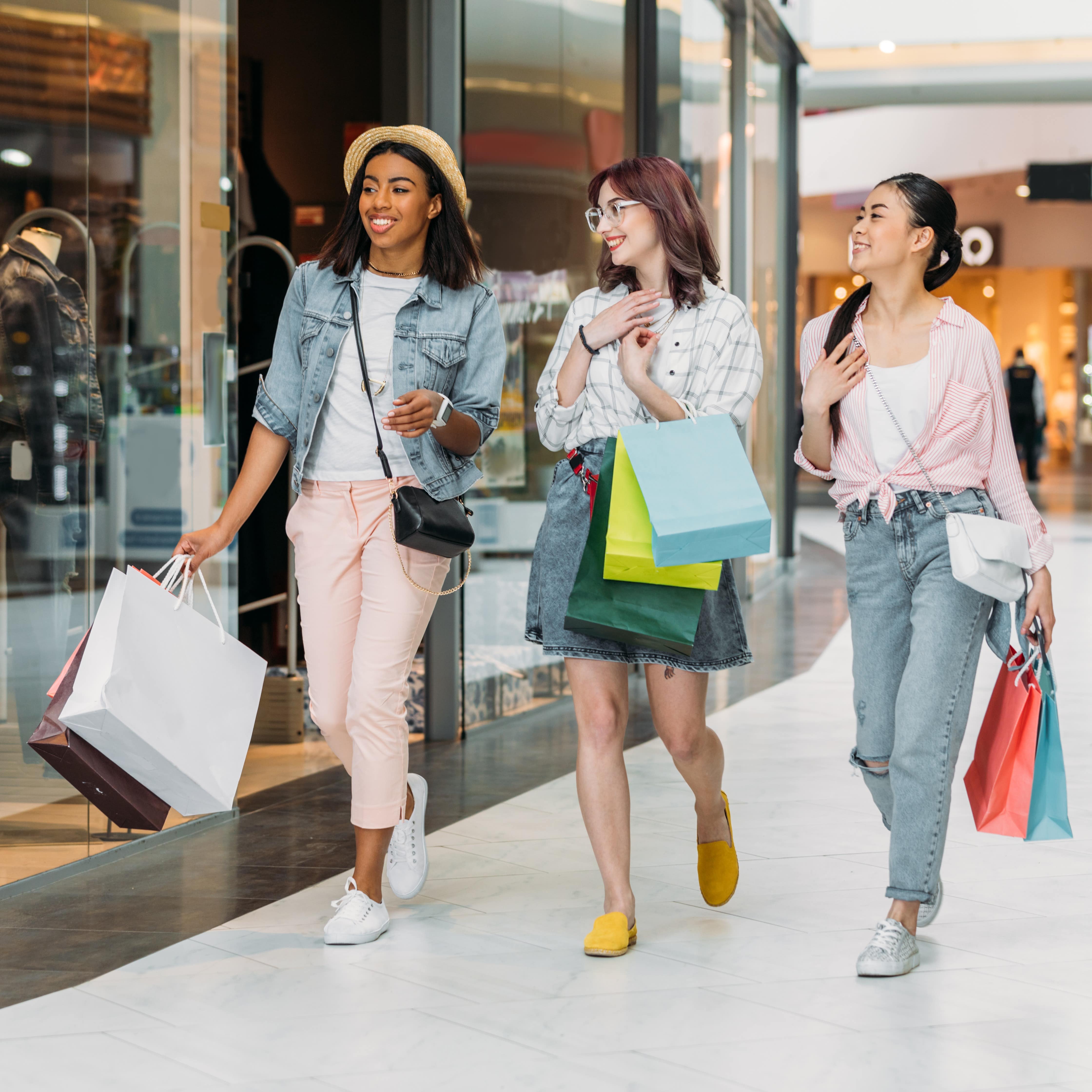 Three women shopping at mall