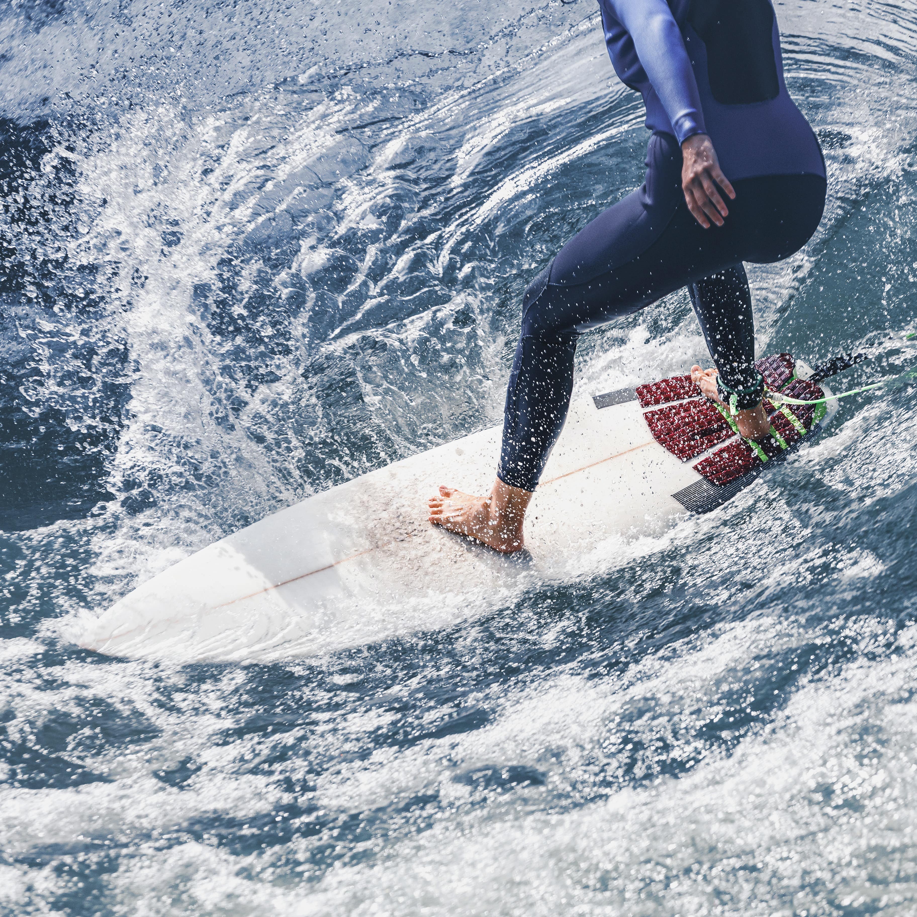 Up close legs of surfer