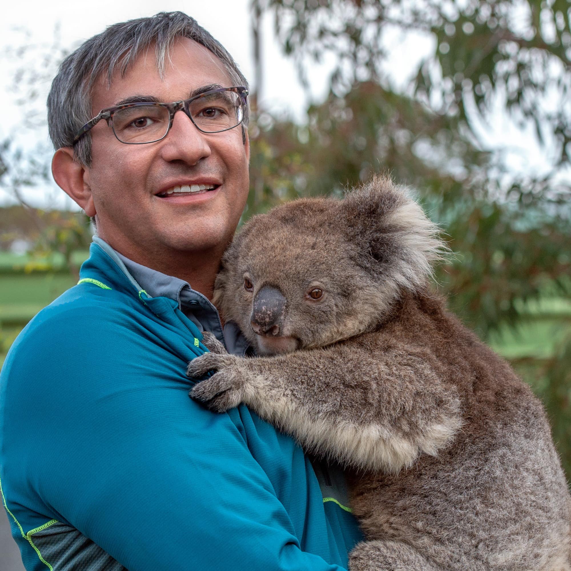 Man holding a koala