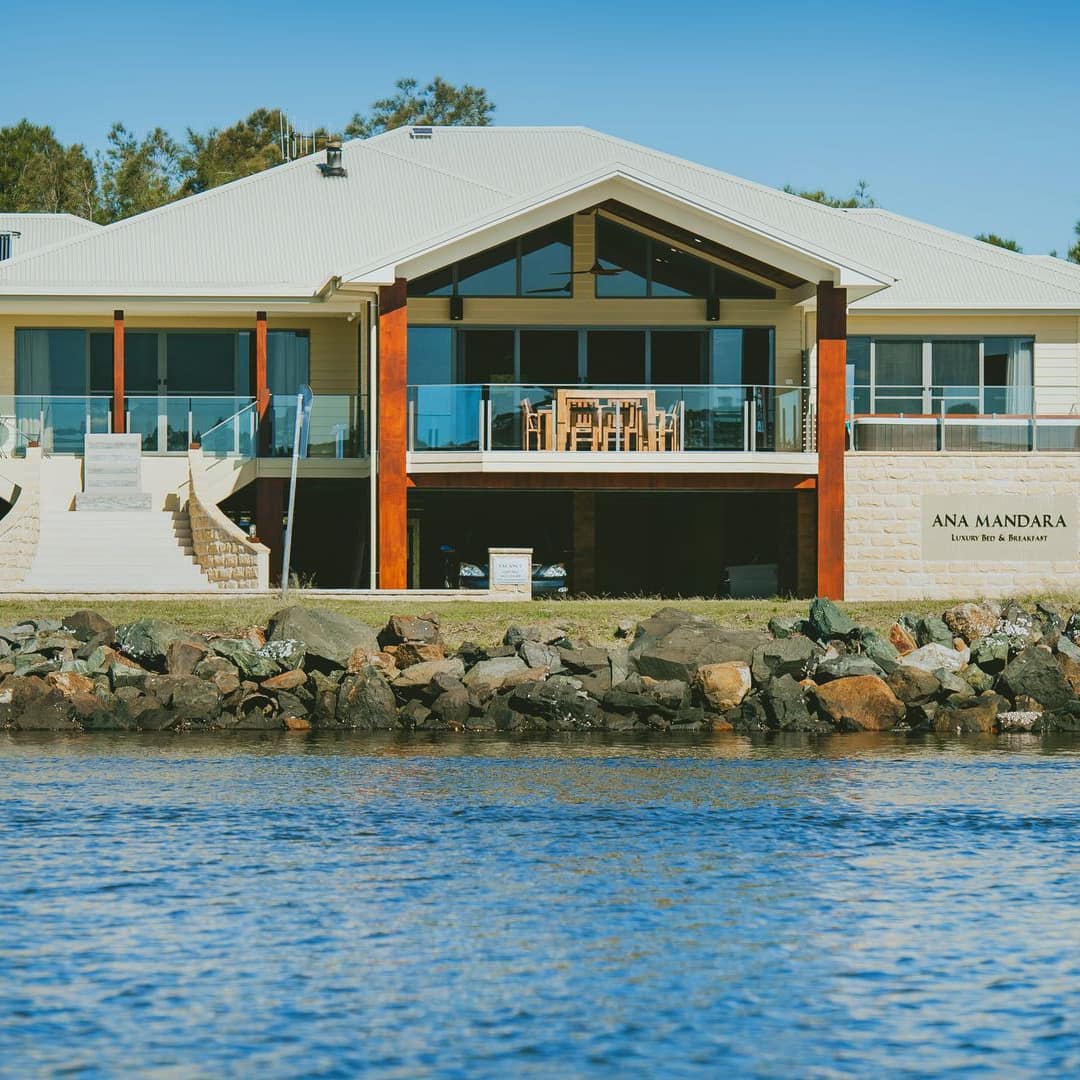 Ana Mandara luxury bed and breakfast along Hastings River with 2 storeys with balcony on the waterfront