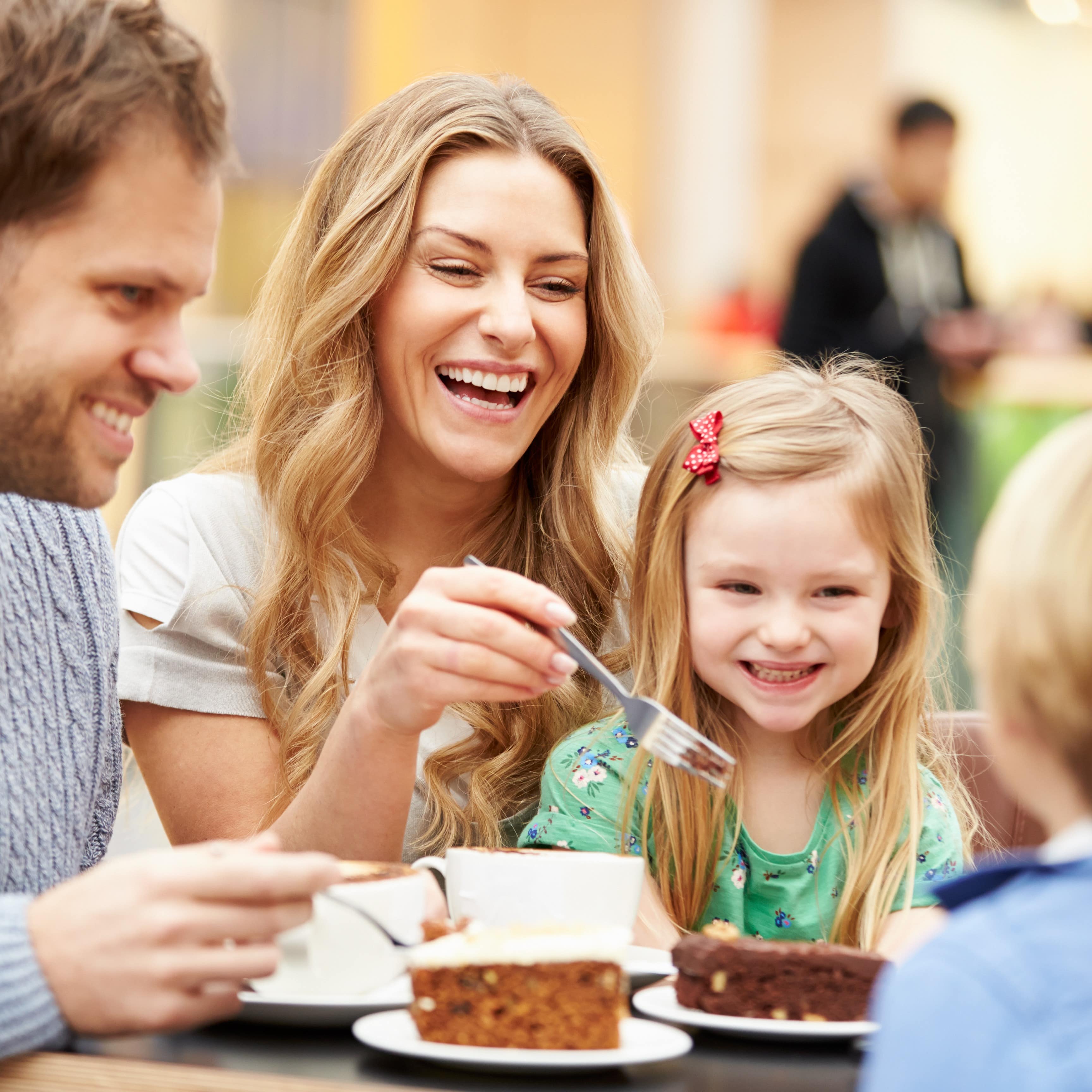 Family enjoying sweet treats at cafe