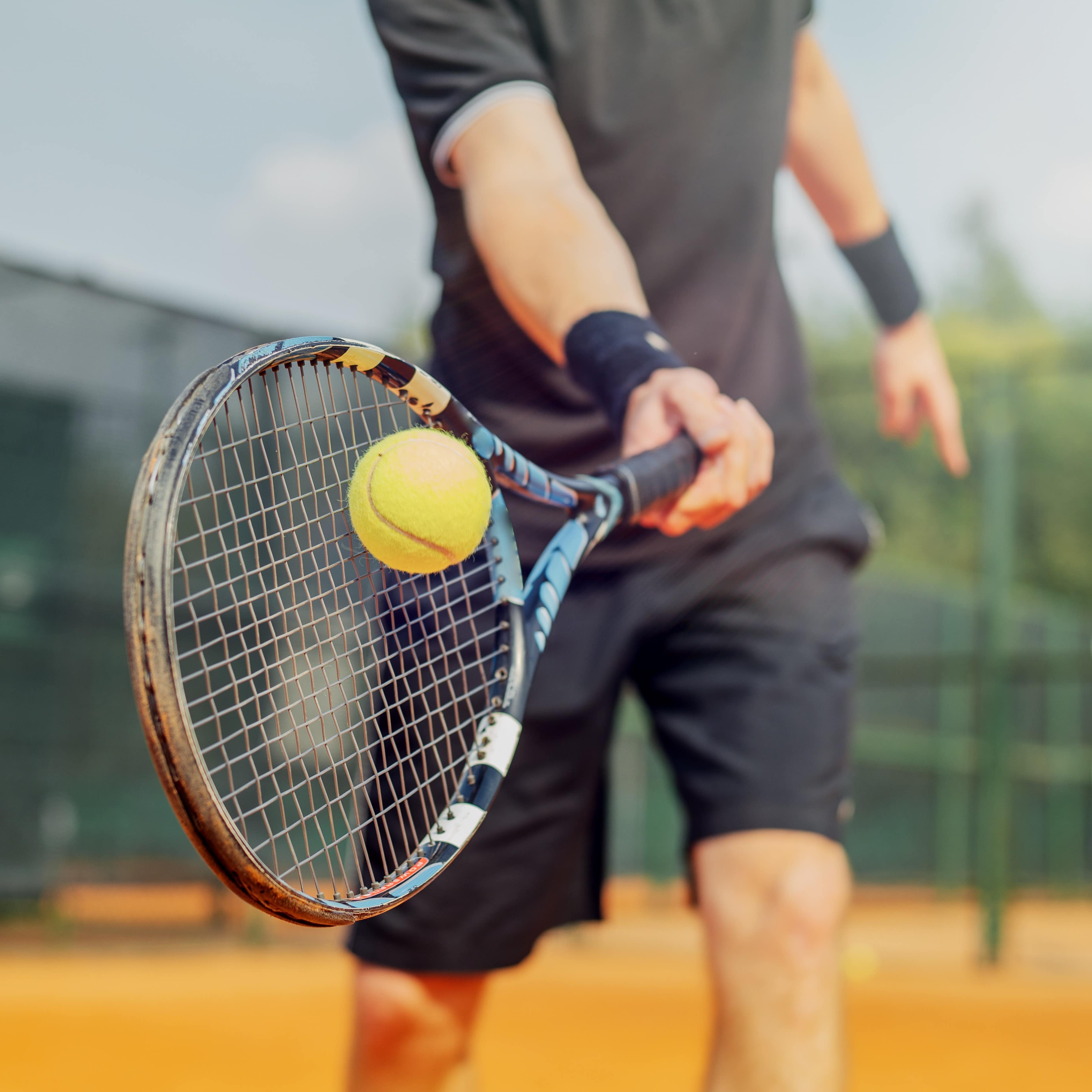 Close up of man playing tennis