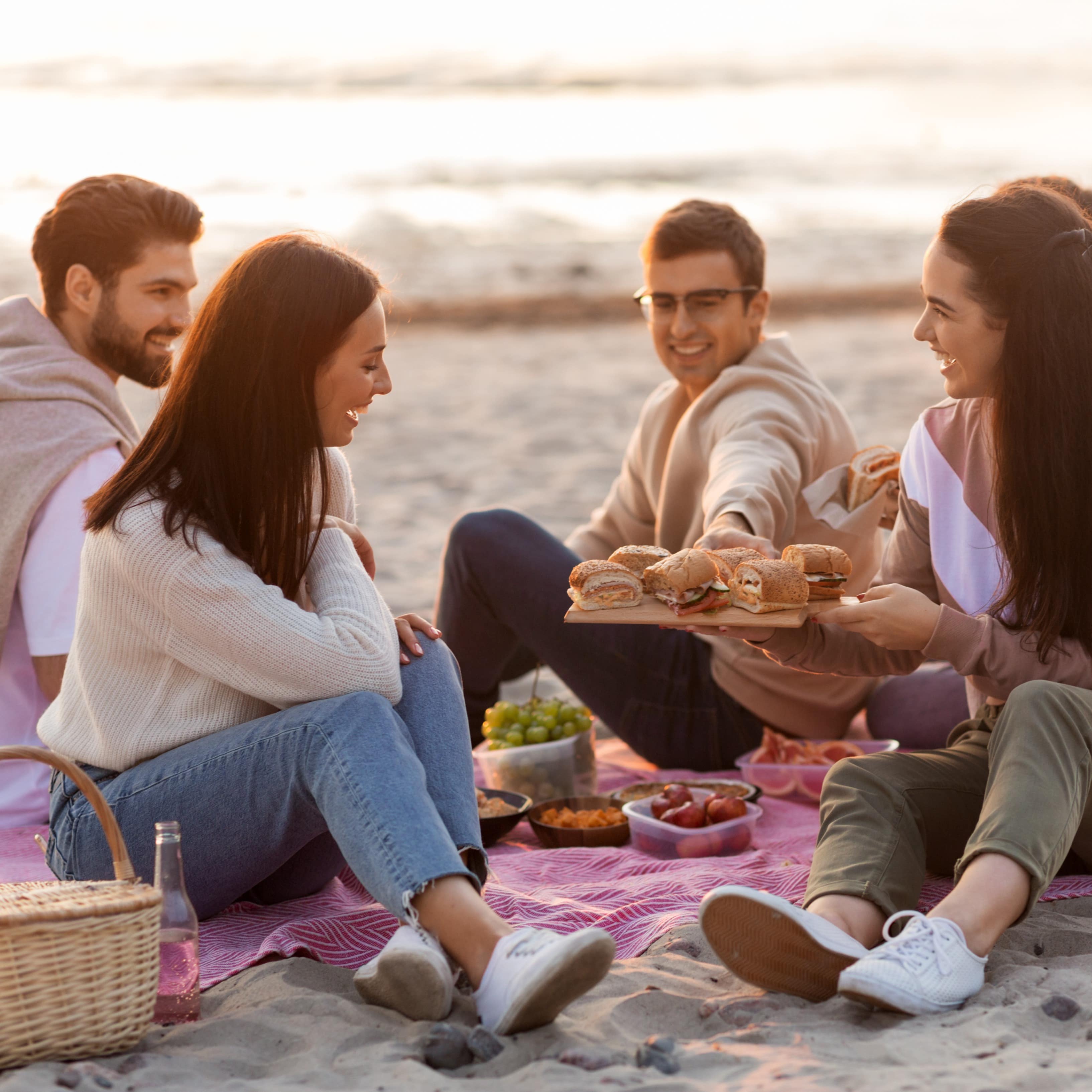 Several people having a picnic on the beach