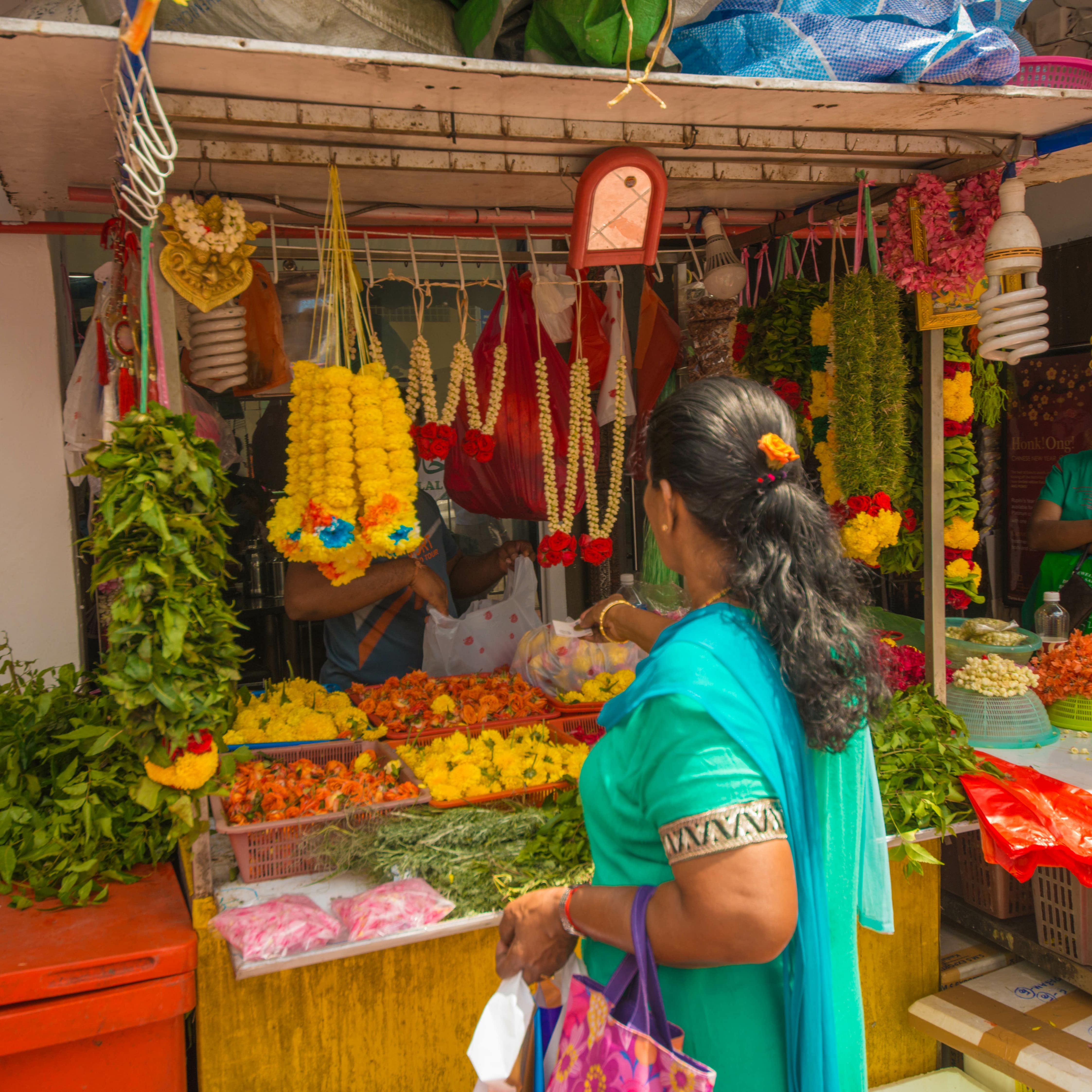 Woman shopping at a street market in Little India, Singapore