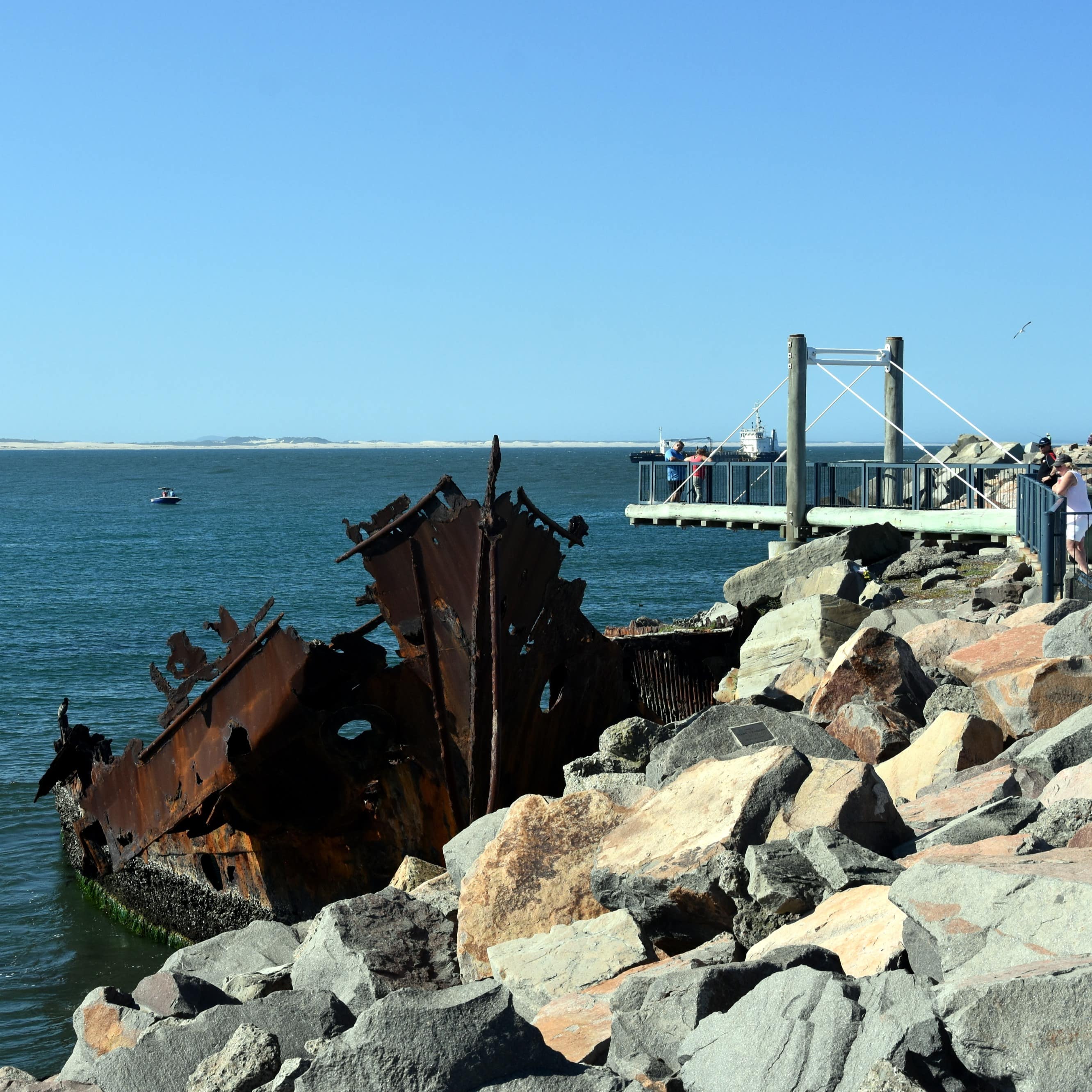 People on a platform looking at the Adolphe, a sailing ship that was wrecked