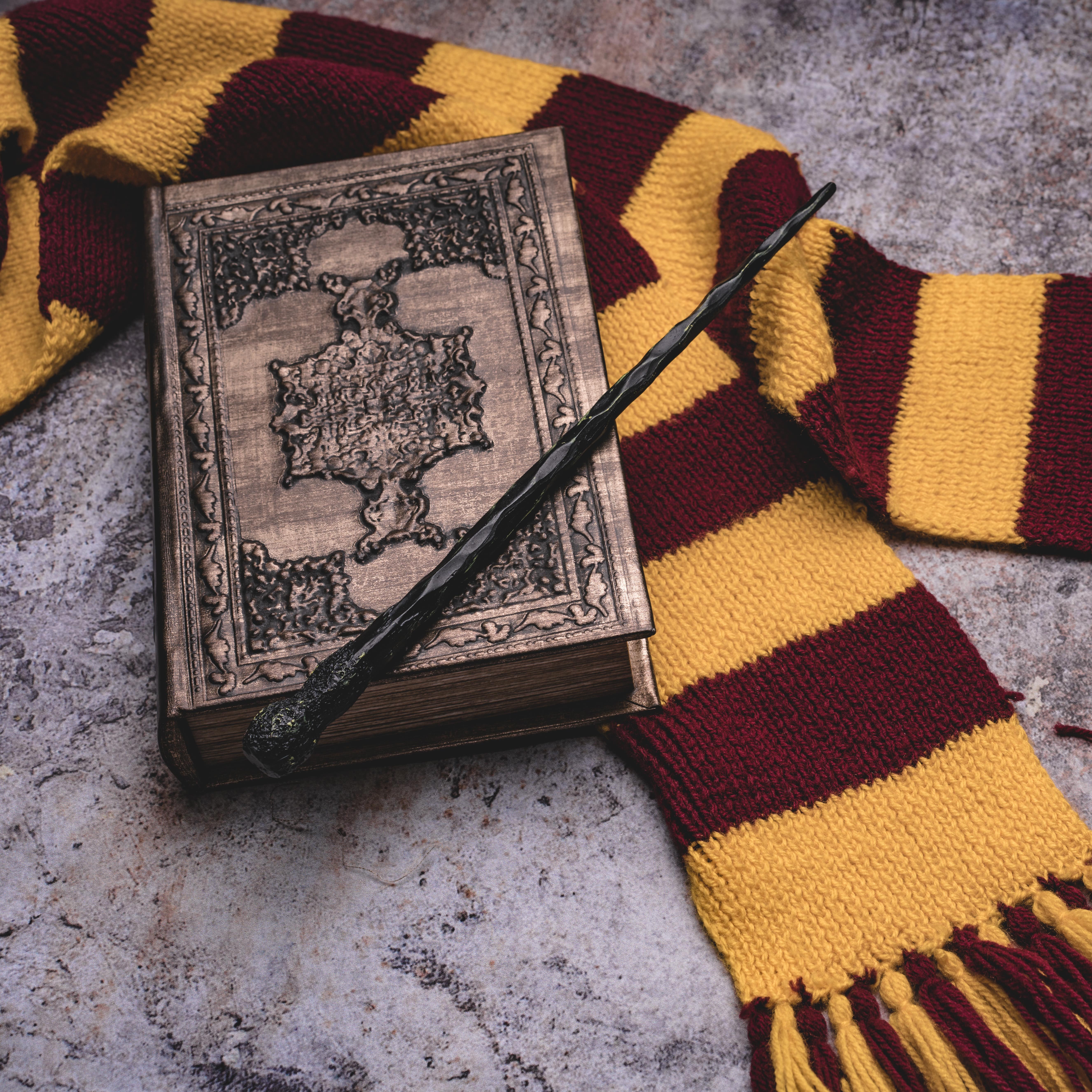 Spell book, magic wand and scarf