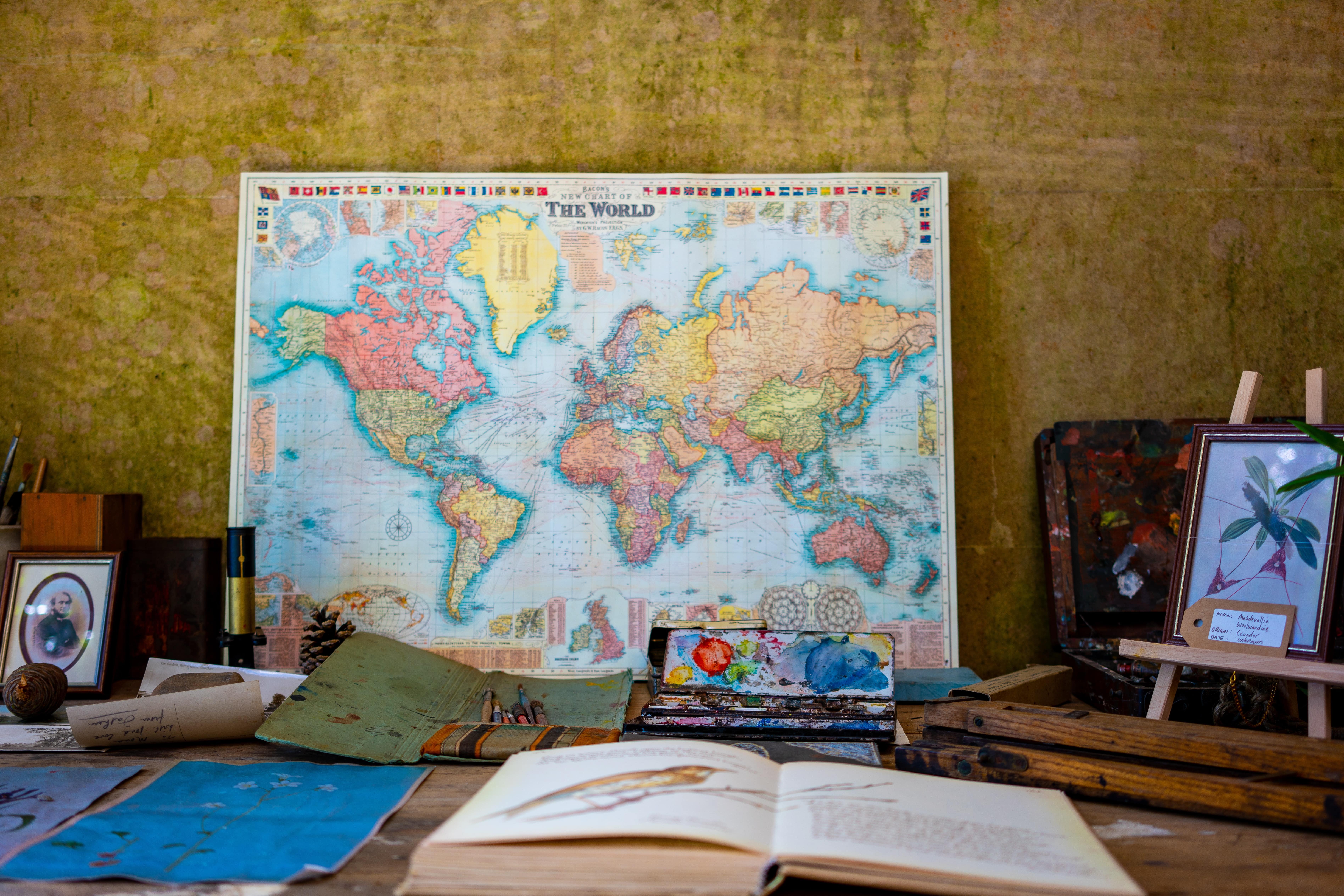 map with books in front- travel planning