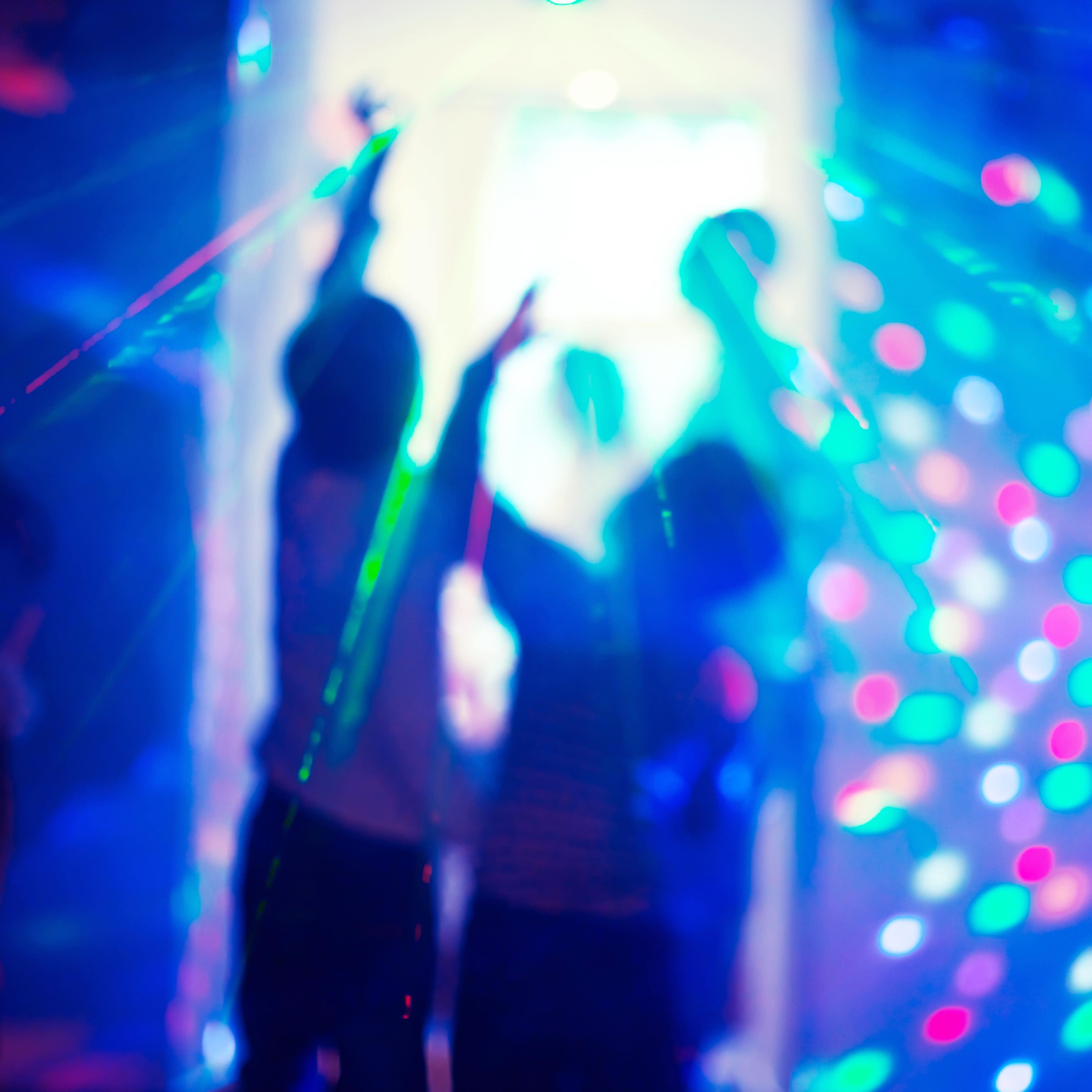 Two children at event with laser lights