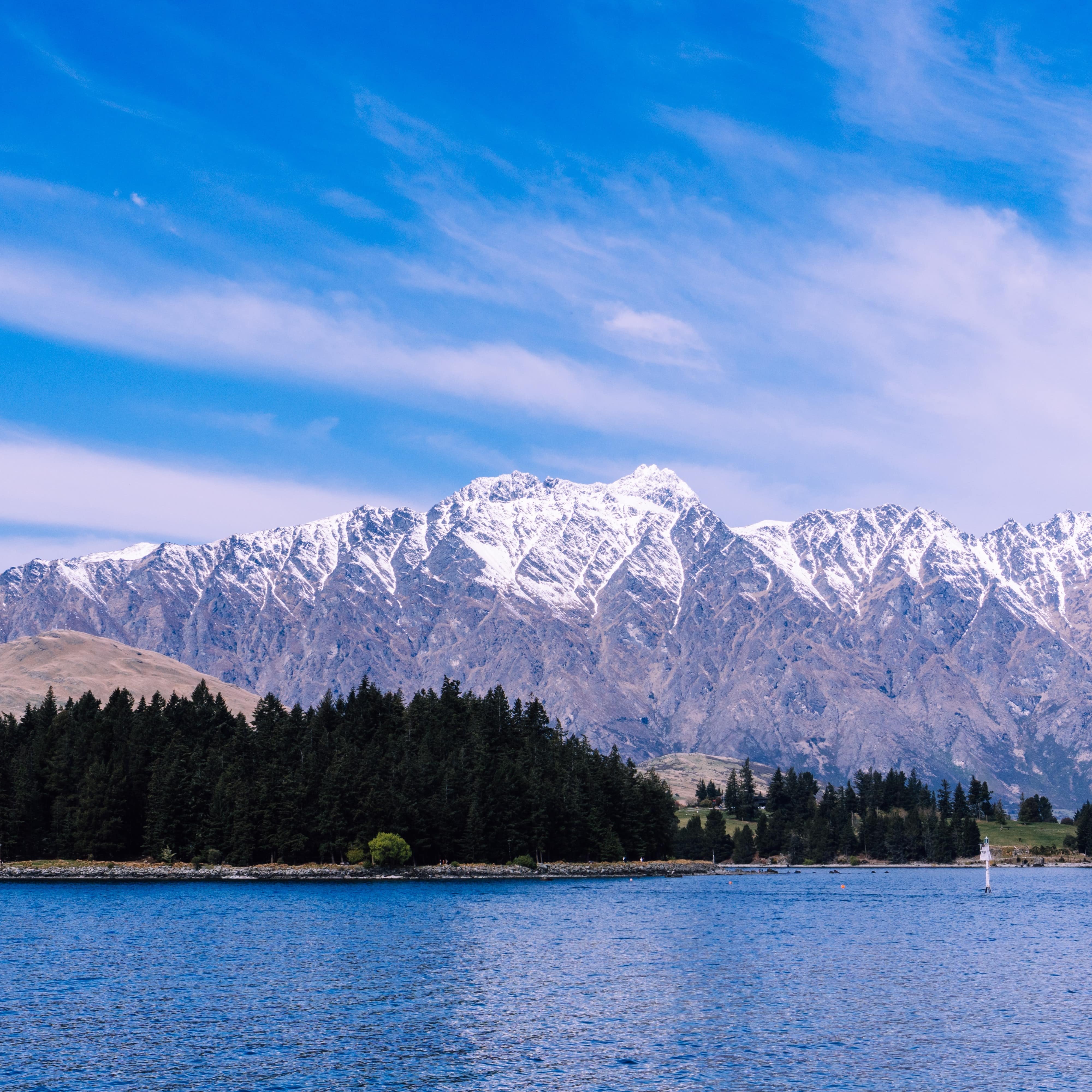 Snow-covered Remarkables from across Lake Wakatipu in New Zealand