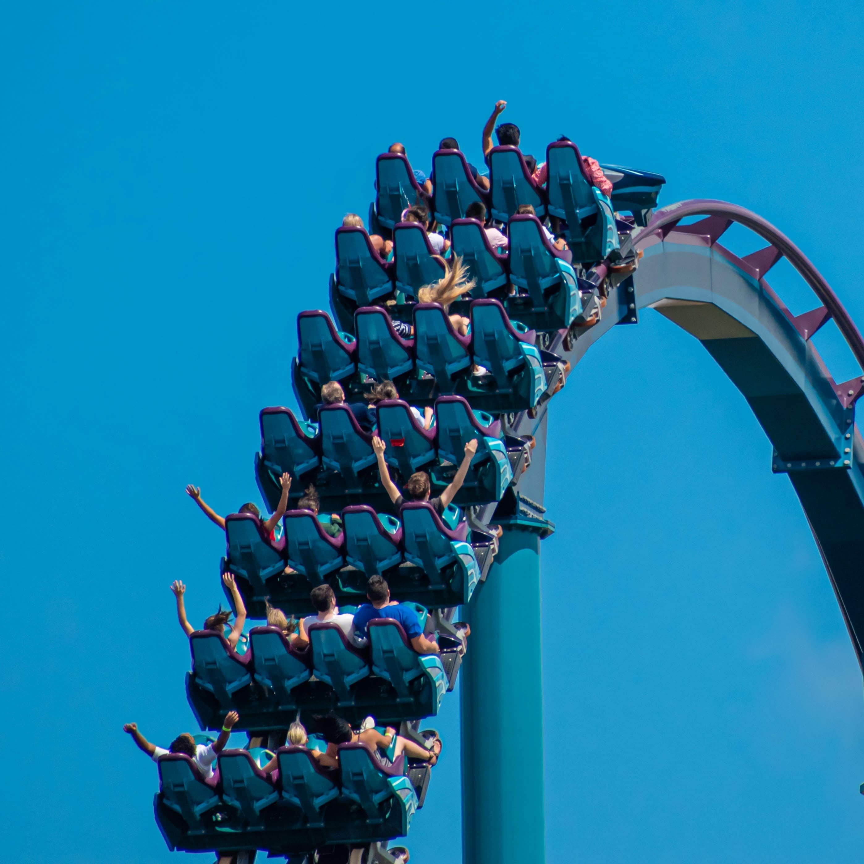 People riding a large roller coaster