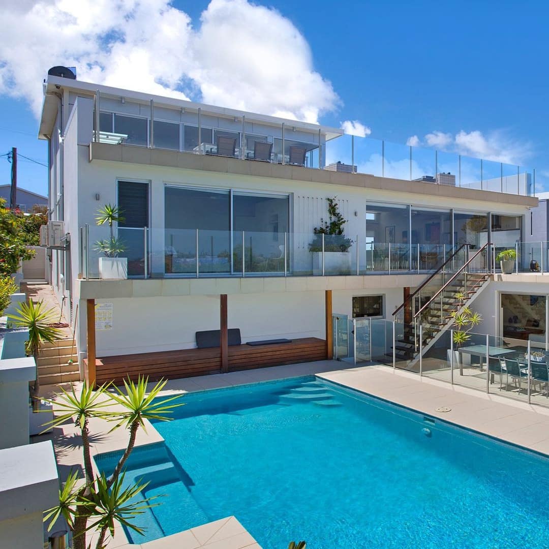 Private pool at 6-bedroom 2-storey beachfront home with windows, balconies and a rooftop terrace