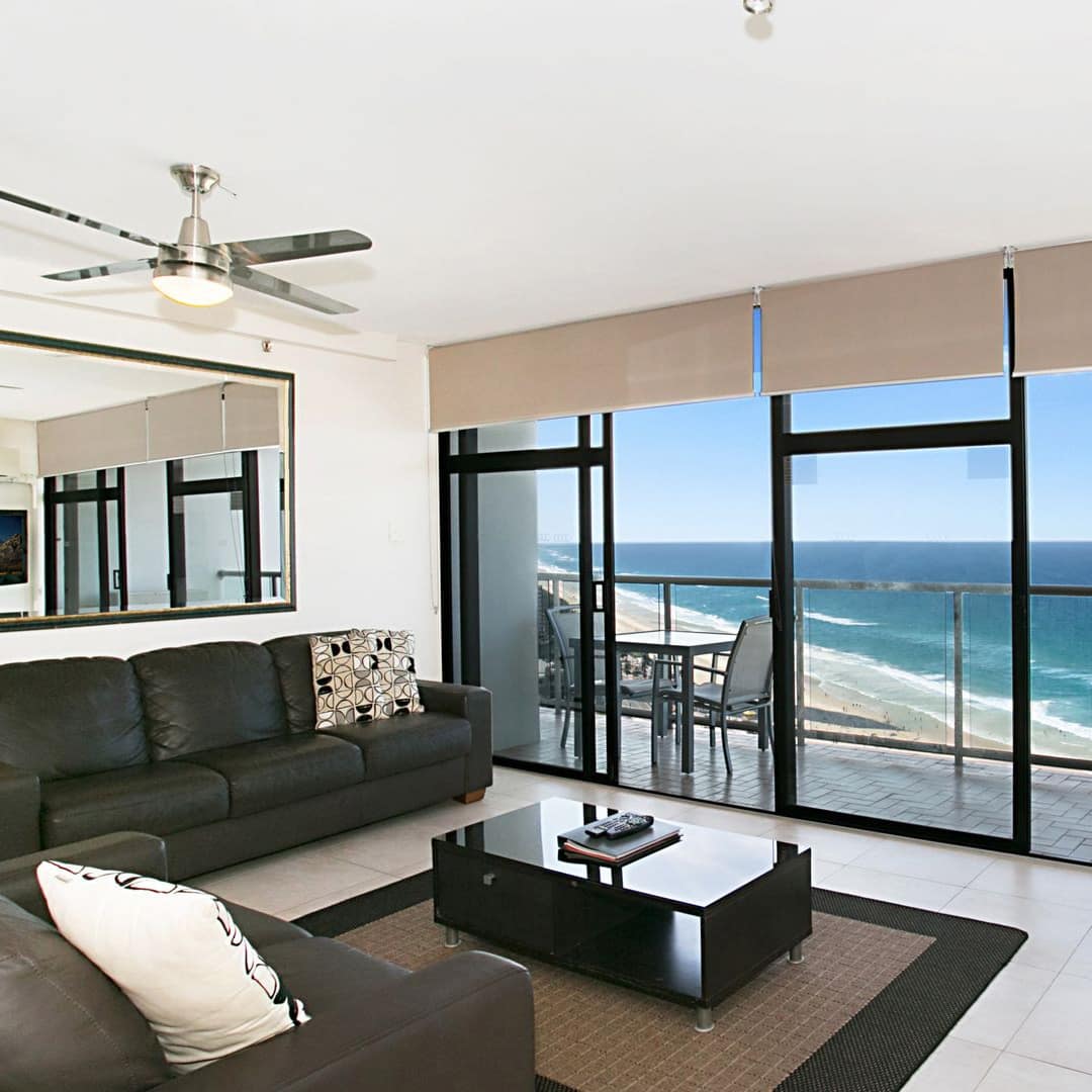 Living area in beachfront apartment holiday home with patio where you can relax and hear the waves