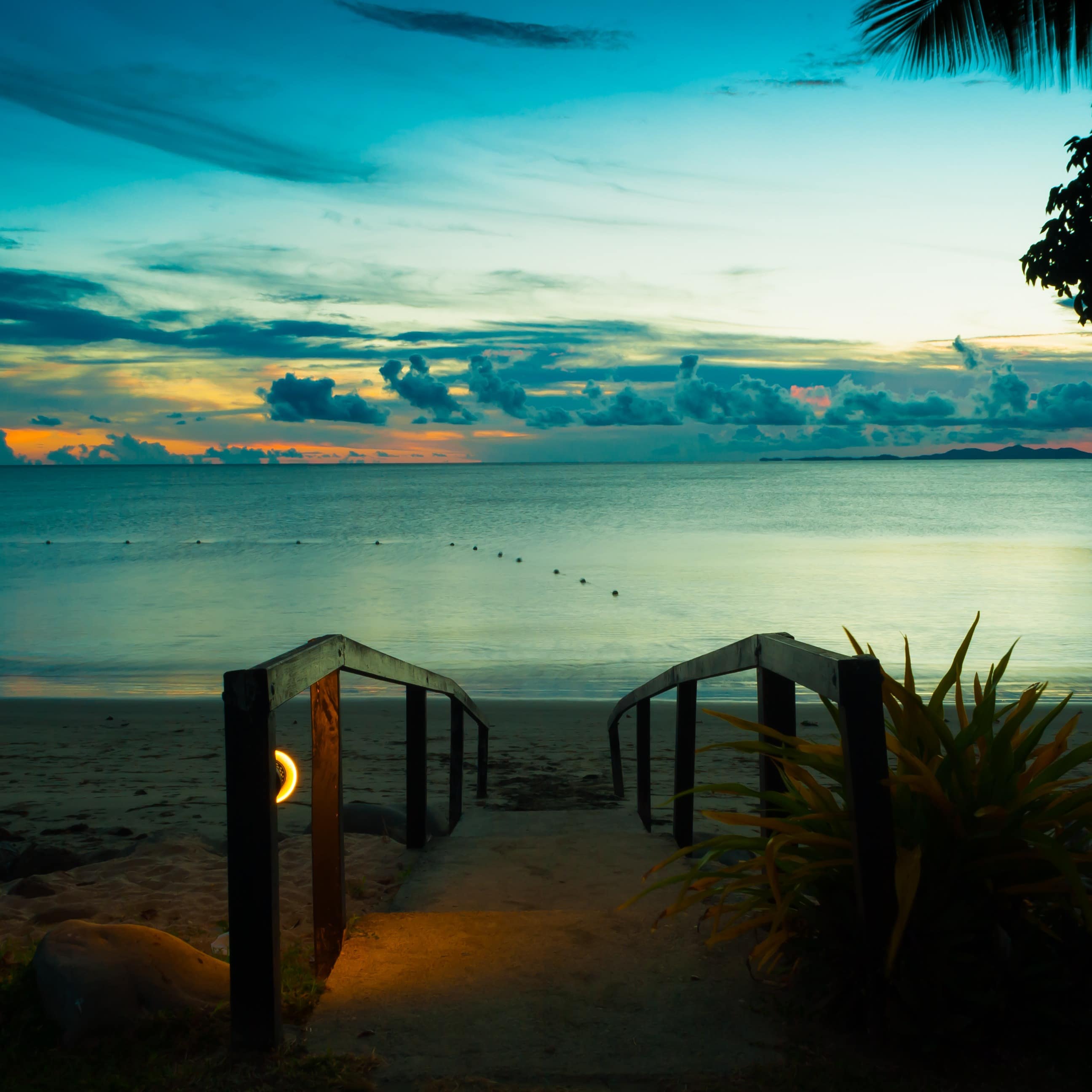 Sunset along path from house to beach on Denarau Island, Fiji looking out to the sea