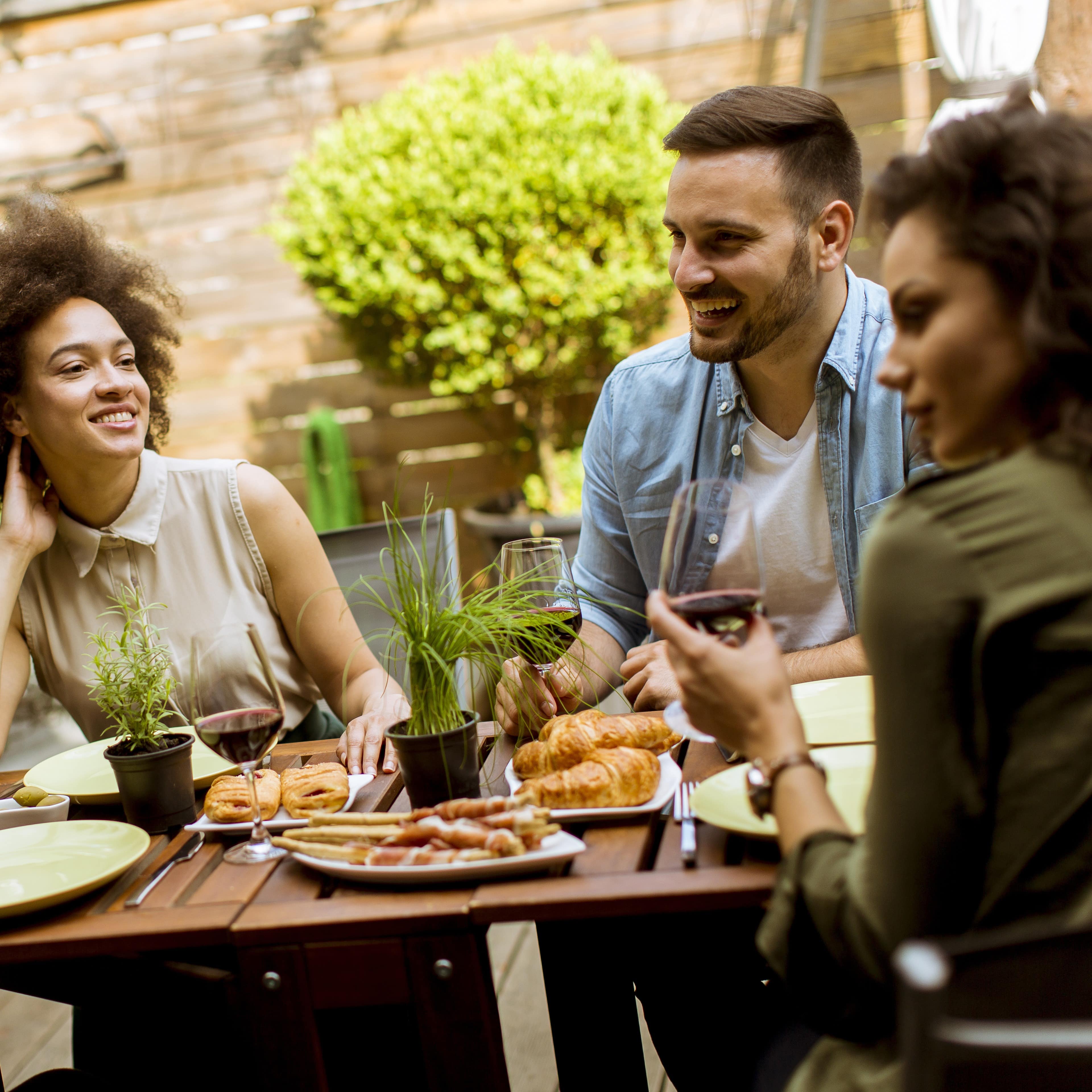 Two couples eating at an outdoor cafe