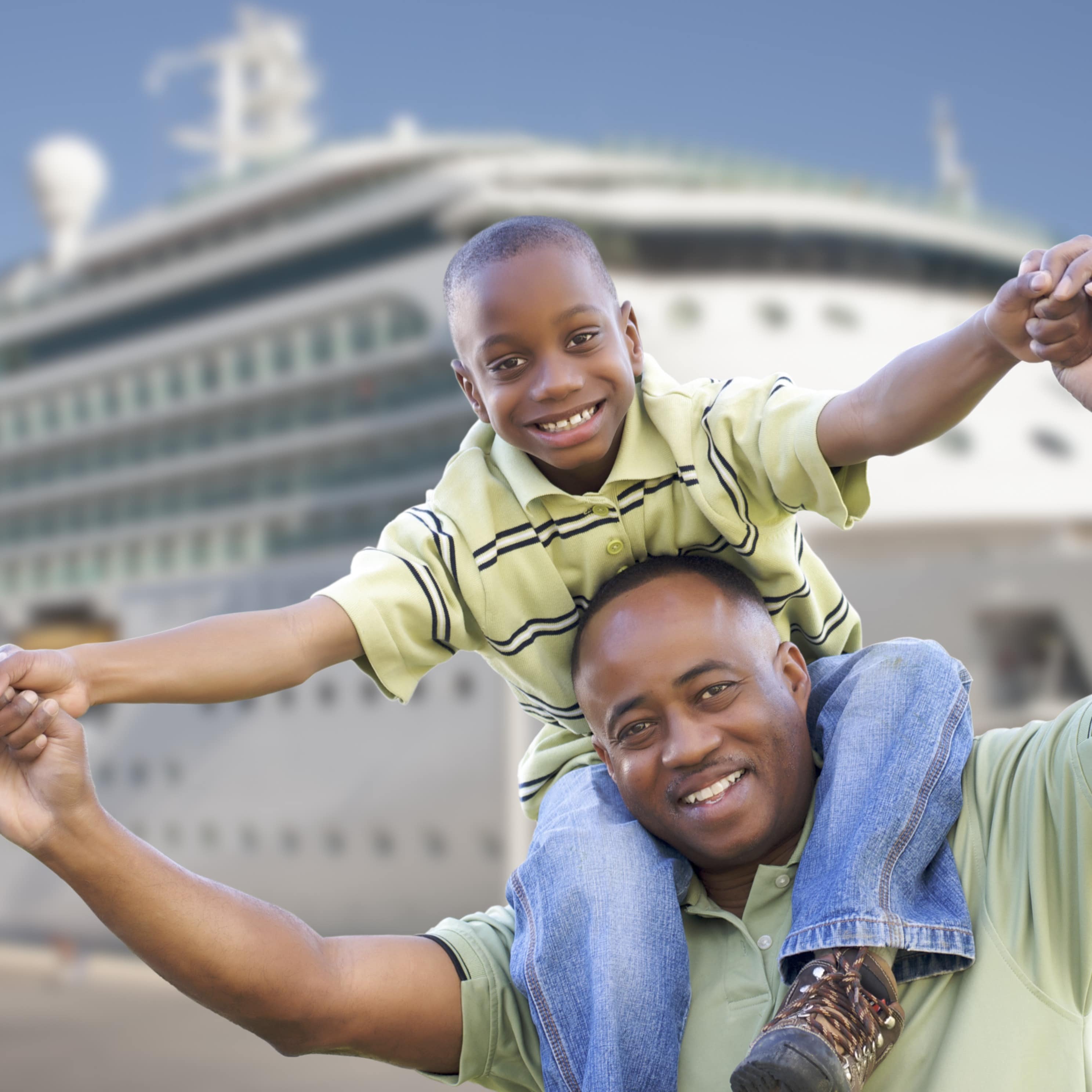 Father and son in front of cruise ship