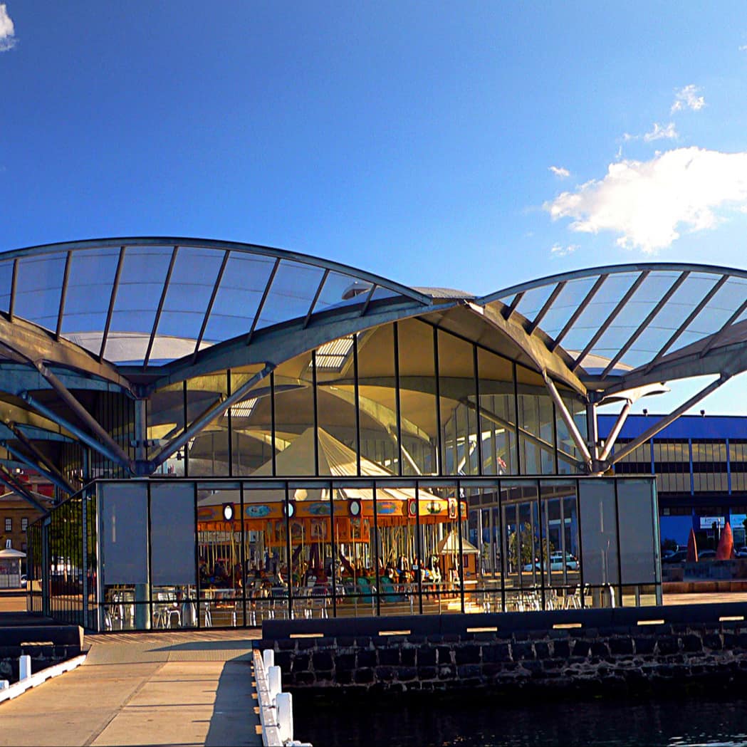 Modern steel and glass pavilion that houses Geelong’s colourful Armitage Herschell Carousel on the waterfront at Corio Bay