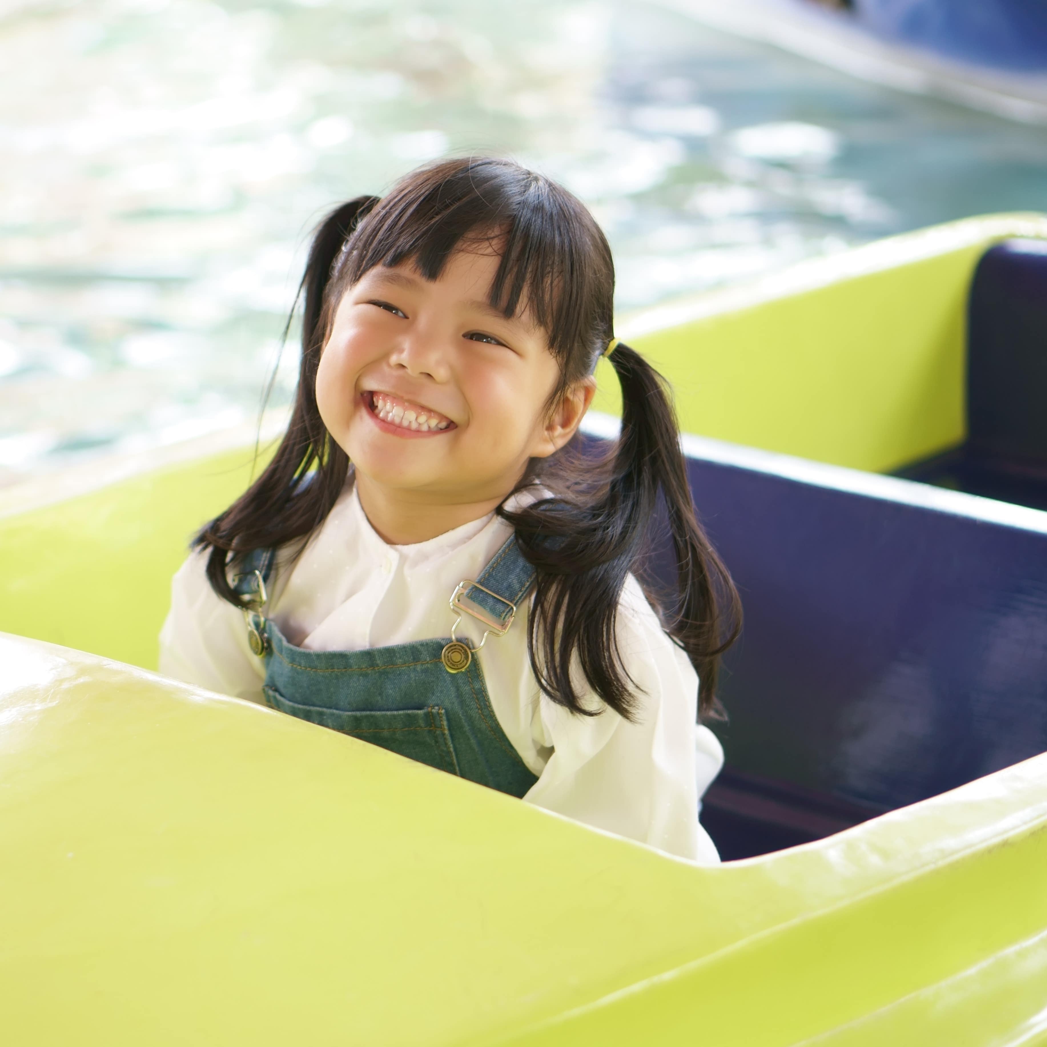 Little girl on water ride at an amusement park
