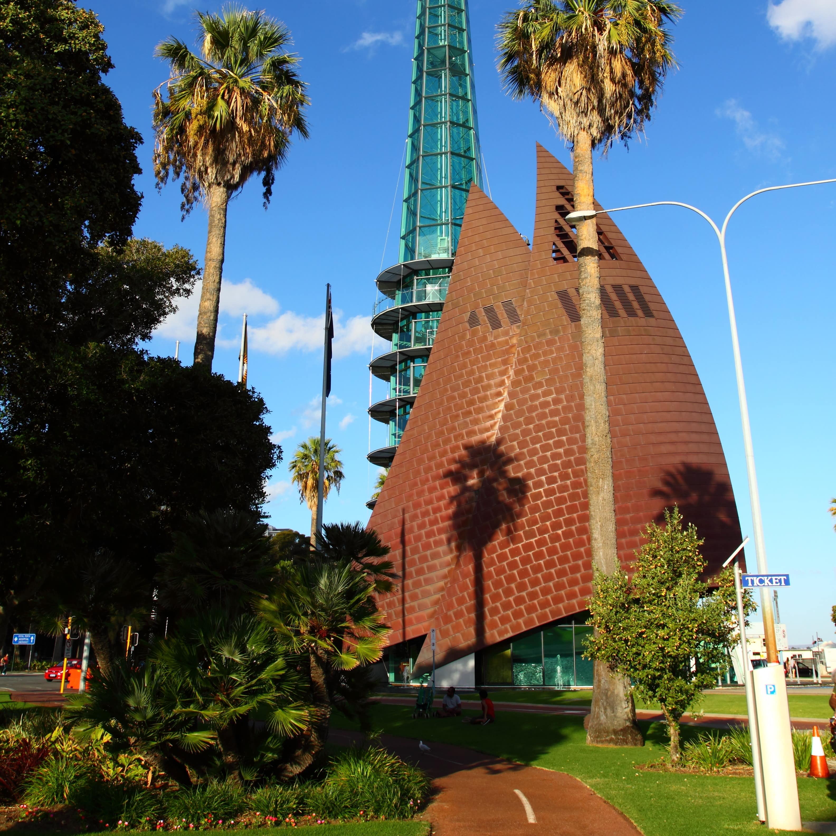 Bell Tower in Perth, Australia with walkway in foreground against blue sky and clouds